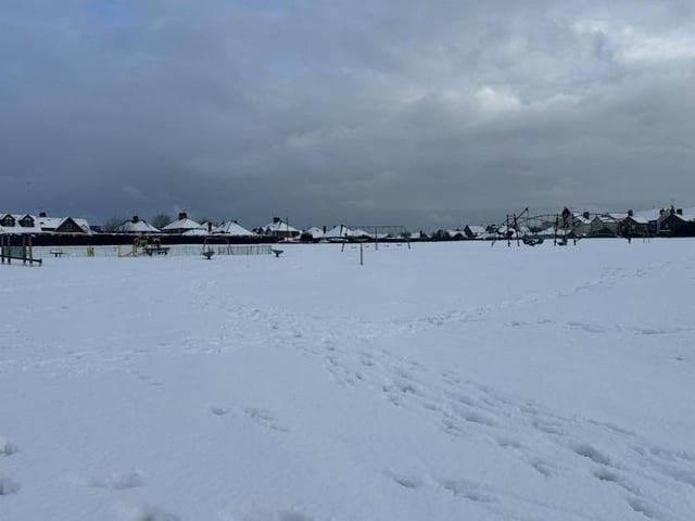 Snow lying deep and crisp and even on a Sutton play park.
