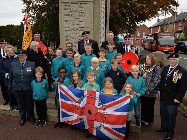 A past launch of the Royal British Legion poppy appeal at Kirkby War Memorial. Pictured are children from Kingsway Primary School and Coun Glenys Maxwell helped with the launch.