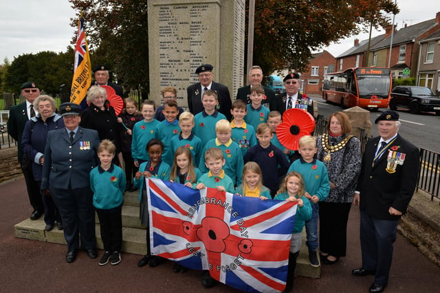 A past launch of the Royal British Legion poppy appeal at Kirkby War Memorial. Pictured are children from Kingsway Primary School and Coun Glenys Maxwell helped with the launch.