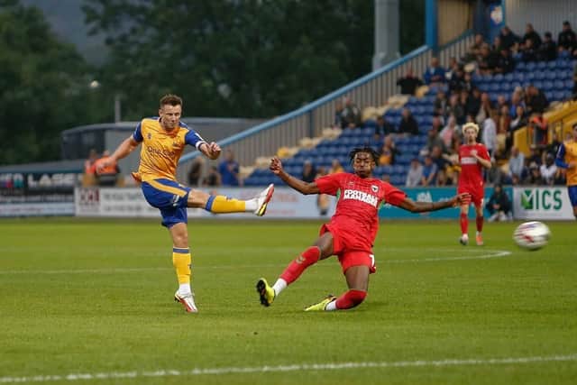 Olllie Clarke fires wide for the Stags against AFC Wimbledon.