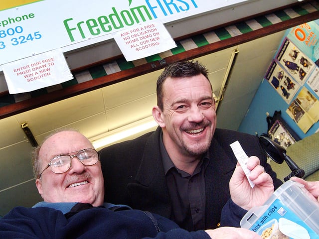 Ken Carnell, left, chairman of the Sutton Board of the Citizens Advice Bureau, drew the winning ticket for a new mobility scooter with Paul Guy, Director of Freedom First who had a shop at the Sutton Indoor market. Photo taken in 2007.