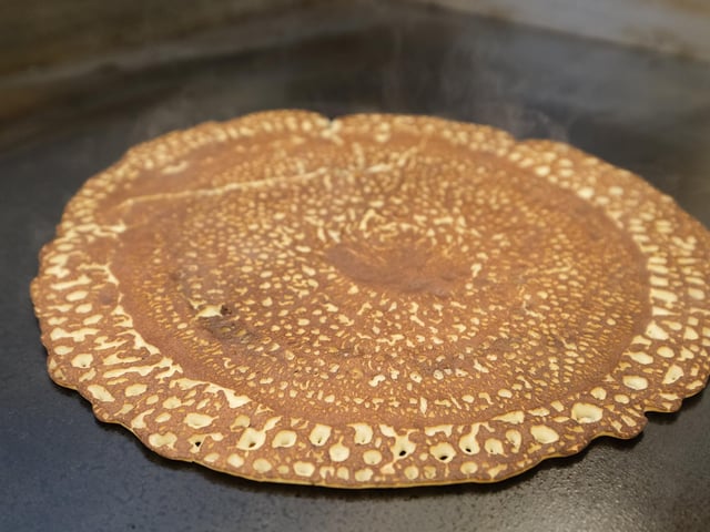 After flipping the pancake, leave if to cook for another minute or until browned on both sides.