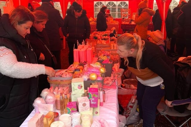 Residents browse the stalls for Christmas gifts.