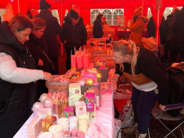 Residents browse the stalls for Christmas gifts.