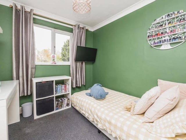 A third bedroom that has a single bed, but there is still plenty of size about the space..