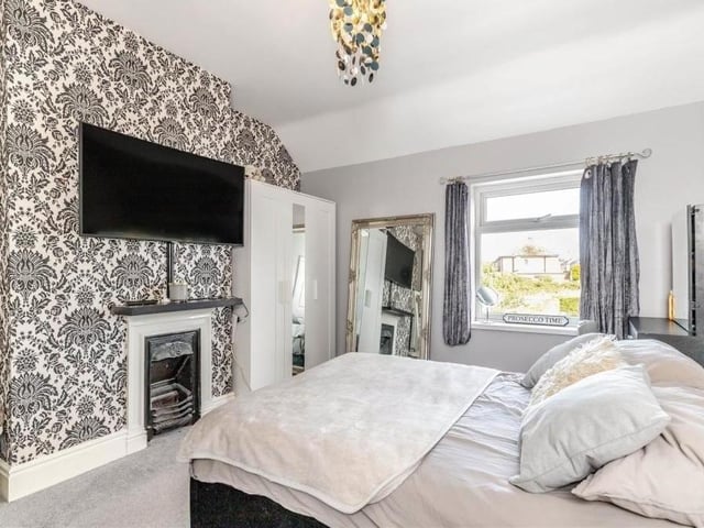The second bedroom also includes this original cast-iron feature fireplace.