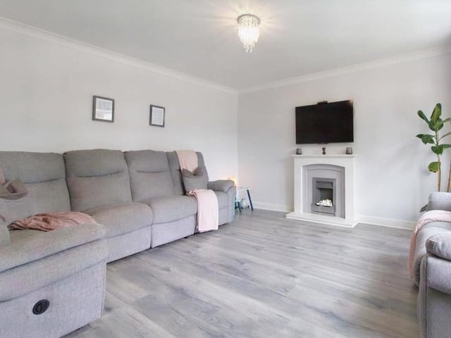Double doors on the left of the hallway steer you into this comfortable lounge, which is well proportioned and pleasing on the eye thanks to its light grey decoration. Feel the warmth from its stone-surrounded gas fire