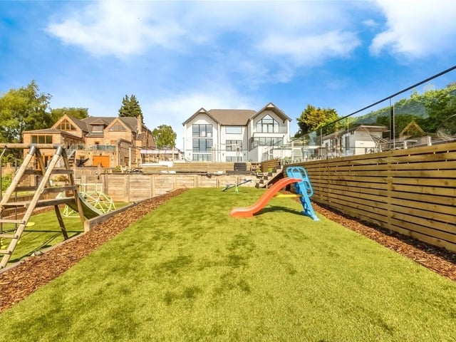 An artificial turfed lawn space is ideal for the kids.