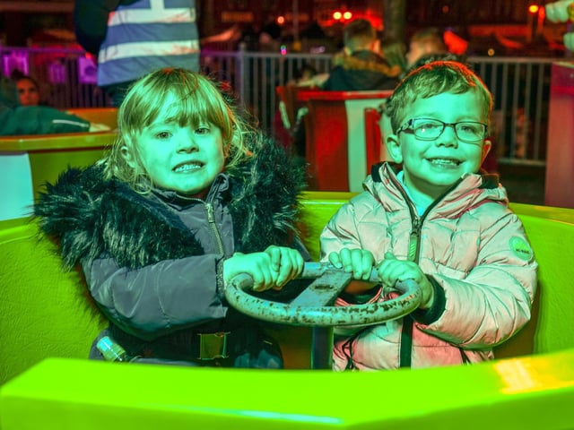 Christmas light switch on at Sutton Market Place. Pictured; Ella and Charlie enjoying a ride on the fair.