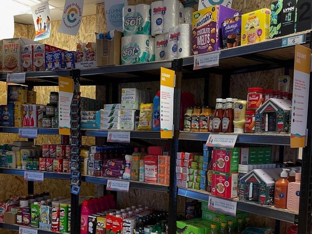 The store sells a range of food and essentials typically found in supermarkets or food banks.