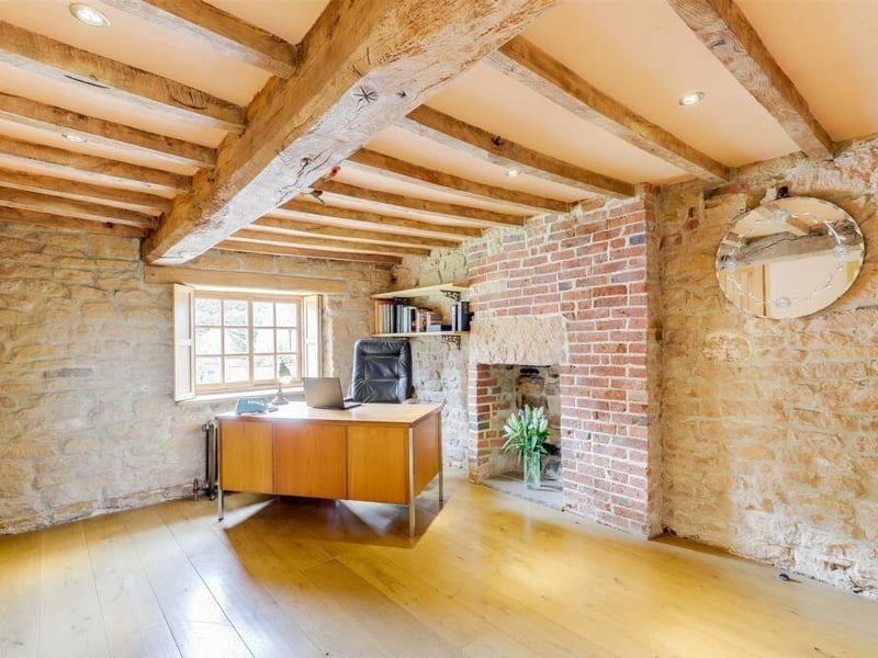 This spacious double bedroom could easily be utilised as a home office. Appealing features include in-built, fitted wardrobes, a solid-oak floor, exposed oak beams to the ceiling, recessed spotlights, an exposed brick wall and an exposed-brick, recessed chimney-breast alcove.
