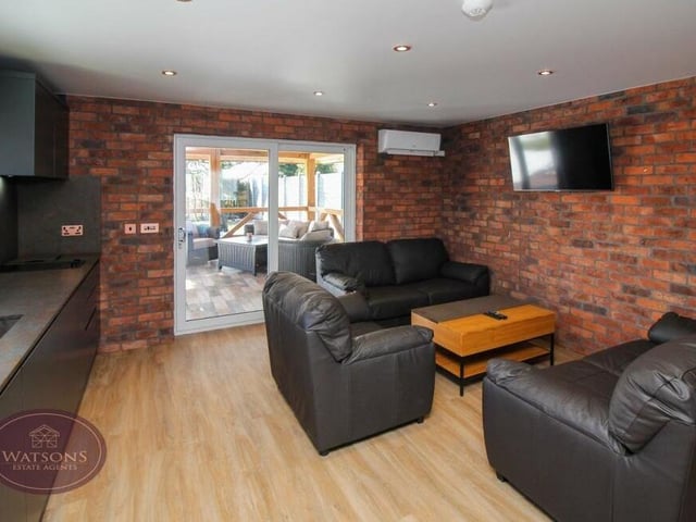 Another look at the comfortable living area within the annexe. The sliding doors lead to a veranda.