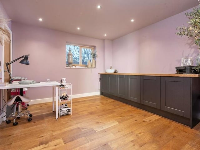 Just off the kitchen is this handy utility room, which is blessed with wall and base units and wooden work surfaces over. There is an inset sink, with chrome mixer tap, and space and plumbing for a washing machine.