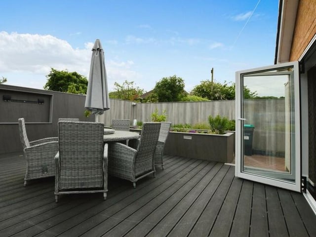 Here is another pleasant seating area, this time on decking at the back of the bungalow. Ideal for alfresco dining.