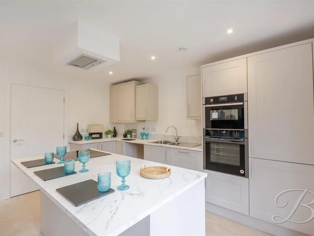 This impressive three-storey, three-bedroom home is situated on the desirable High Oakham Hill, offering flexible living spaces and modern comforts throughout. This location is perfect for families with nearby schools, shops, transport links and green spaces. The stylish open-plan kitchen/diner features a central island and patio doors opening directly onto the rear garden-perfect for entertaining or family gatherings.