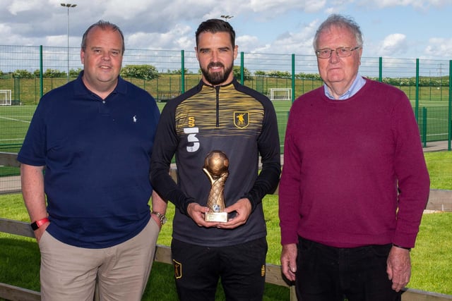 Players' player of the season, sponsored by David Hinds, is handed to Stephen McLaughlin by David and Gary Hinds.