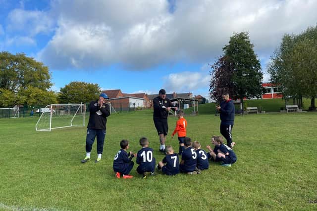 The under sevens team practising on the Brinsley Primary School field.