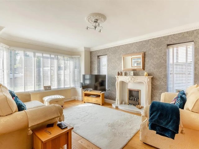 A light and airy, dual aspect reception room. Having a coal effect gas fire with marble hearth. Oak flooring, coving to ceiling, two double glazed windows to the side elevation and large glazed bay window to the front elevation.