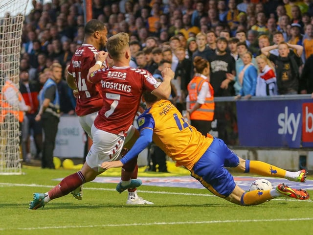 Elliott Hewitt attempts to keep the ball in play.