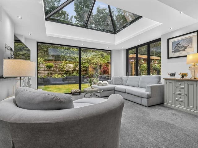 This light filled space has a central ceiling lantern, large floor-to ceiling double glazed windowpane to the rear elevation, two obscure double glazed windows to the side elevation and separate bi-folding doors leading out onto the rear garden.