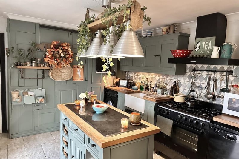 The kitchen has a very individual feel. It features solid oak worktops, a traditional Belfast sink and a matching island with inset granite preparation top. Cleverly concealed sliding doors, with cast-iron rails, provide further larder storage.