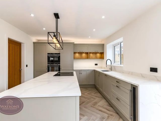Integrated Siemens appliances including; waist height double electric oven, dishwasher, fridge freezer and wine cooler.
