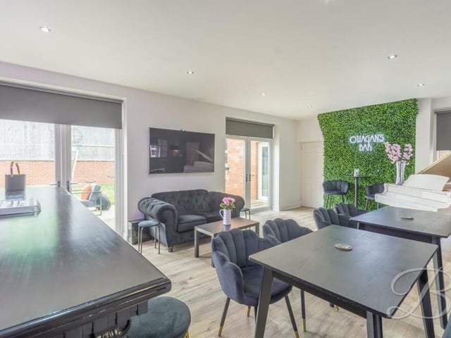 As you can see, the bar has two sets of French doors leading out to the garden. It's the perfect spot for entertaining during the summer.