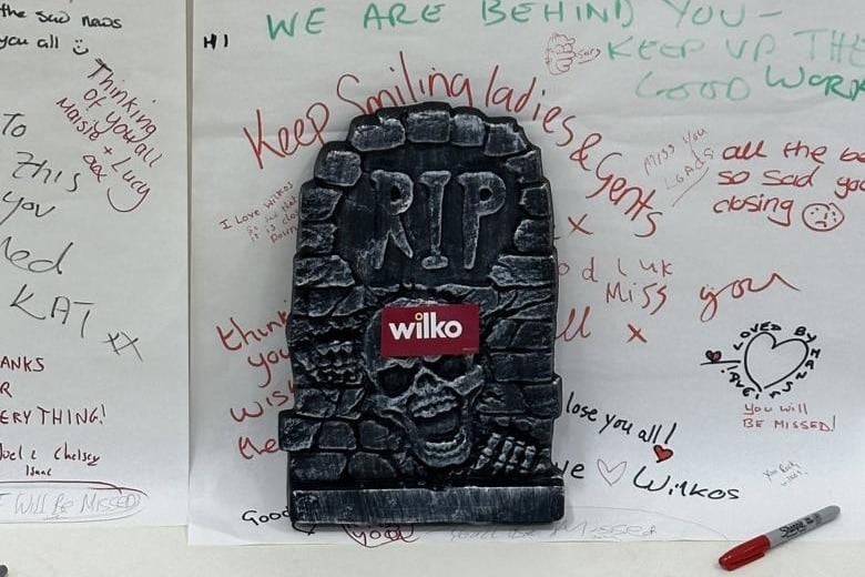 Thank you cards and messages of support were left for staff by former colleagues, present team members, and customers at the front of the store. A Halloween decorative gravestone with a Wilko sticker summed up the closure.