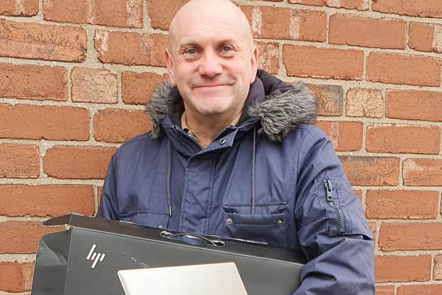 Neil Temple from David Blounts Estate Agents with one of the laptops.