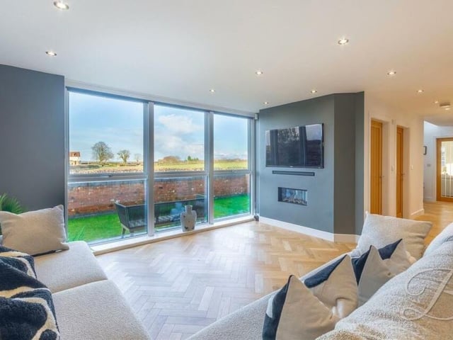 From the open-plan living area, you can take in views not only of the big-screen TV but also of the Pleasley Vale countryside through bi-folding doors.