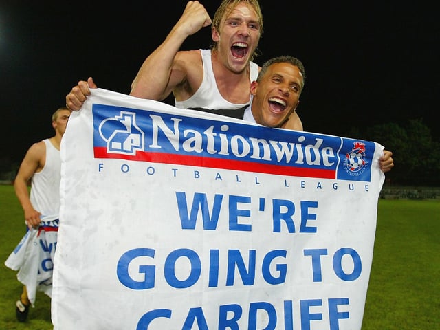 Liam Lawrence and Keith Curle celebrate. Lawrence scored with Mansfield's second penalty. He wasn't quite so lucky with his cheeky second penalty in the play-off final.