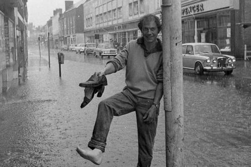 Shoes off at West Gate while walking through the flood.