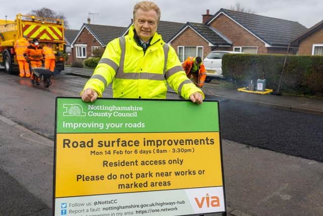 Coun Neil Clarke, the Conservative chair of the county council's transport and environment committee, during road repair work in Rainworth earlier this month.