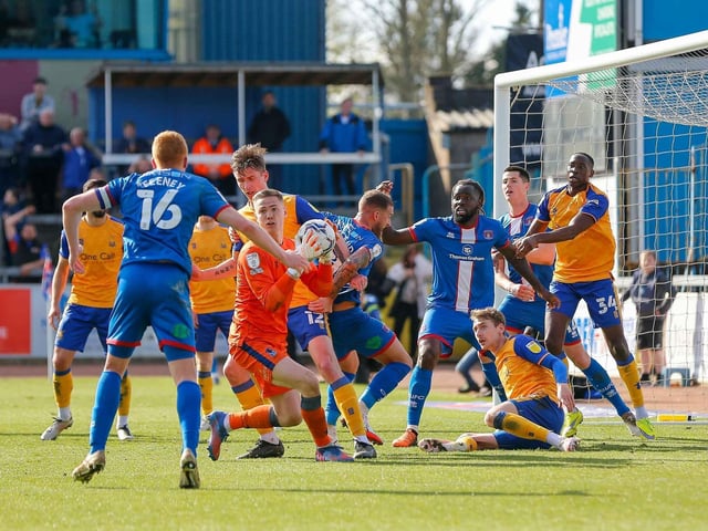 Chaos in the box at Carlisle United.