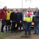Silvano Taylor of Mansfield Senior Reds Walking Football Club presenting a cheque for £400 to John McFadden of Notts Blood Bikes. Pic by Richard Parkes.