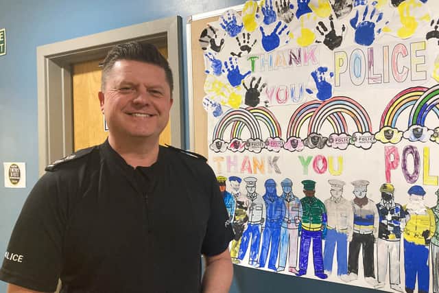 Inspector Nick Butler with the artwork now on display at Mansfield Police Station.