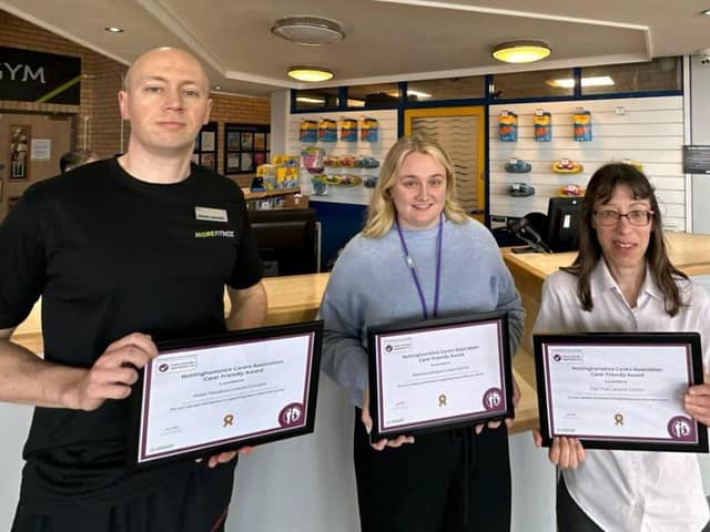 More Leisure's Carl Smith and Carolyn Hallam, right, celebrate their quality marks with Paige Miles, of Nottinghamshire Carers Association.