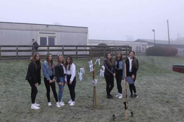 Evie's school friends pictured with the tree planted in her honour at Garibaldi school.