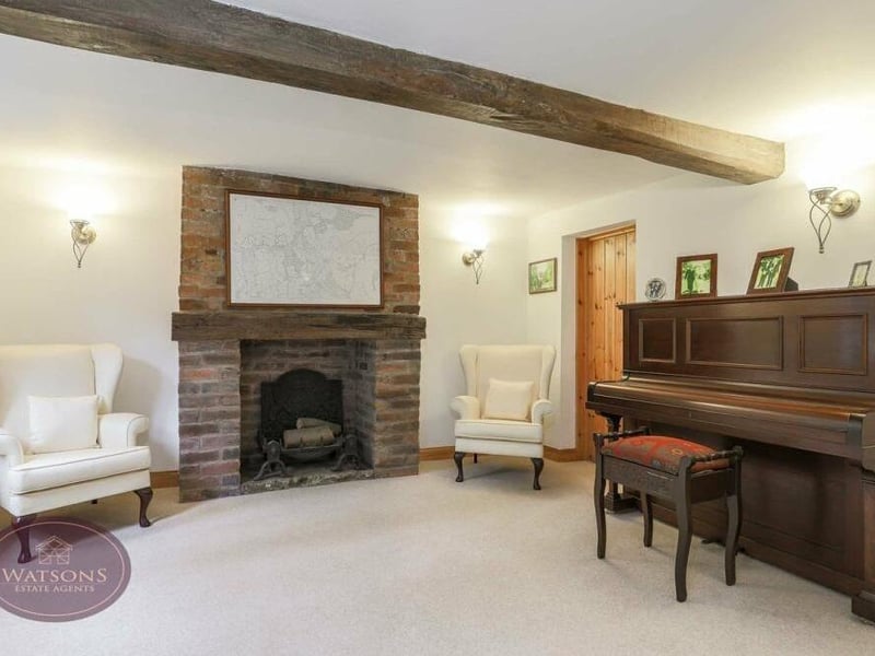 Next stop on our tour is this cosy sitting room, which also showcases exposed ceiling beams.