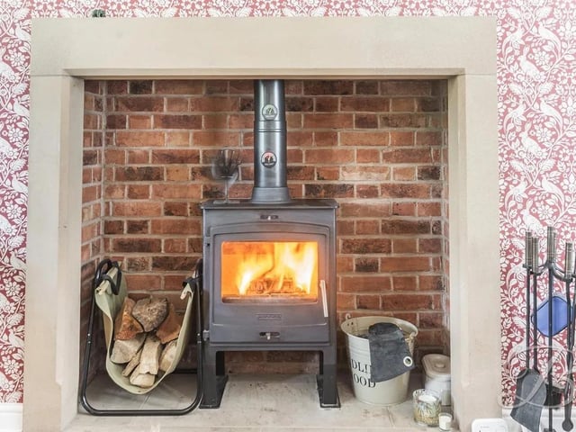 The large feature log burner adds a cosy fell to the living room.