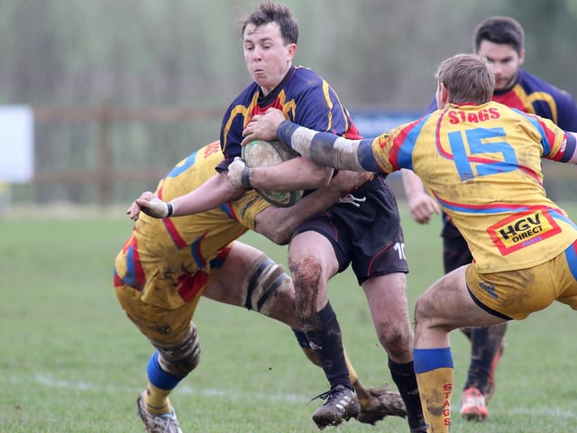 An Ashfield runner is halted by the Buxton defence.