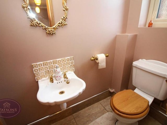 There is a handy toilet downstairs, complete with WC, wall-mounted sink and obscured window.