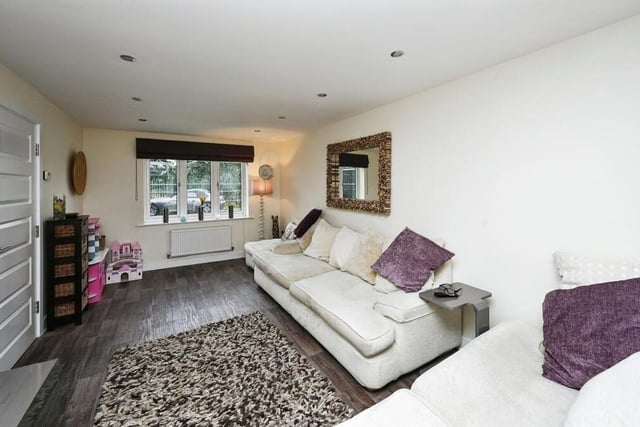 Home comforts can be enjoyed in this plush living room.