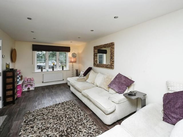 Home comforts can be enjoyed in this plush living room.