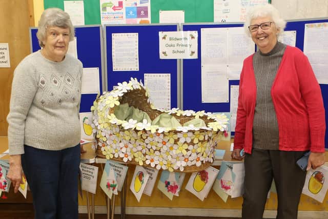 The chief co-ordinator of the weekend, Maureen Garner, and fellow organiser, Sylvia Stubbs, with a display by children from Blidworth Oaks Primary School at a Rocking exhibition at St Andrew's Mission Hall in Blidworth.