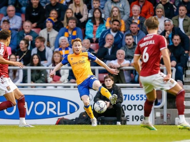 Stags midfielder Stephen Quinn looks to make the cross .