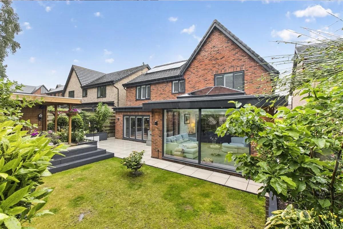To the rear of the property there is a beautiful landscaped garden featuring an extensive patio which extends across the full width of the property providing ample outdoor seating space.