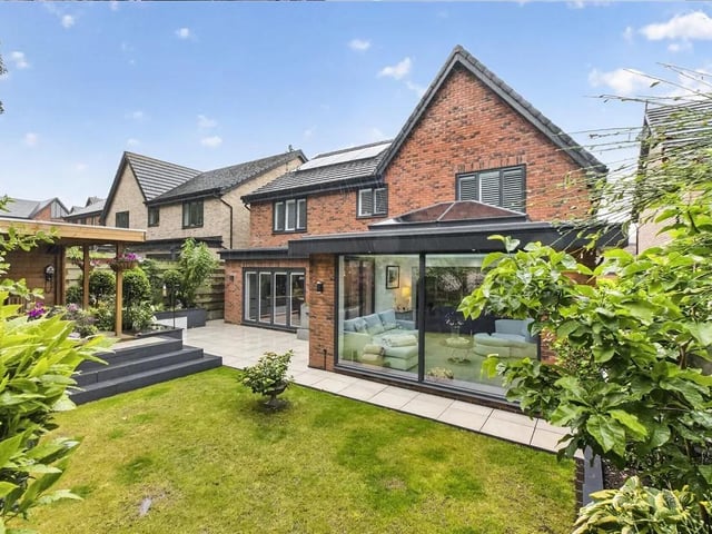 To the rear of the property there is a beautiful landscaped garden featuring an extensive patio which extends across the full width of the property providing ample outdoor seating space.