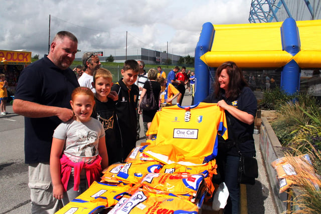 Paul Filipek was buying replica shirts for his children Chloe, Charlie and Jack running the stall is Joanne Dove.