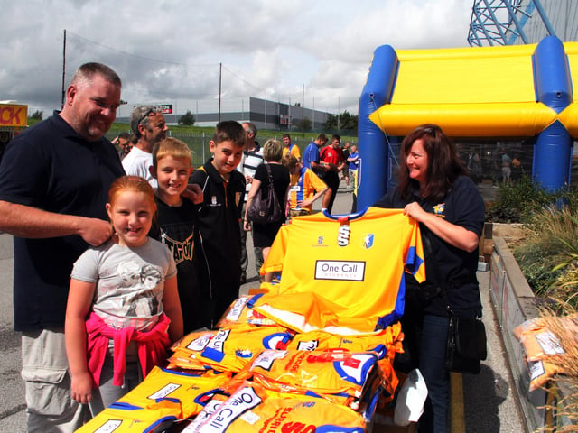Paul Filipek was buying replica shirts for his children Chloe, Charlie and Jack running the stall is Joanne Dove.